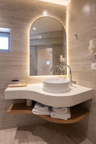 a bathroom with a sink and a mirror at Dimitri Hotel in Himare