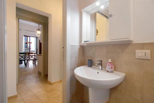 a bathroom with a sink and a mirror at Dimore di Bacco in Rutigliano