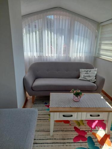 a living room with a couch and a coffee table at Star in Mali Lošinj