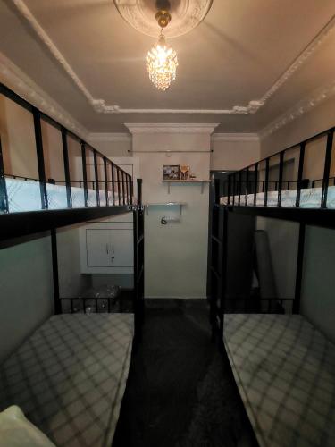 Ένα ή περισσότερα κρεβάτια σε δωμάτιο στο Shared Bed Hostel
