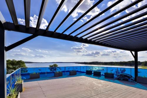 a view from the roof of a house with a deck at Apartamenty Boszkowo Aquarius Platinum in Boszkowo