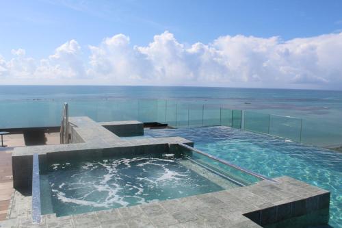 Kolam renang di atau dekat dengan New time Temporada -Studio de luxo vista mar Maceió