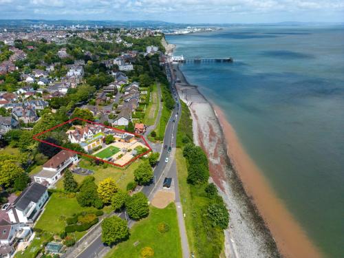 an aerial view of a house on the beach at Holm House - Stylish Coastal Suites - Silures Bar & Restaurant On-site in Cardiff