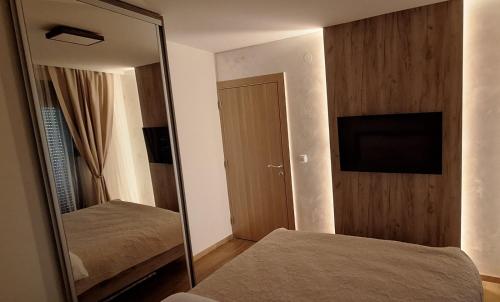 Postel nebo postele na pokoji v ubytování Apartman Zelena laguna