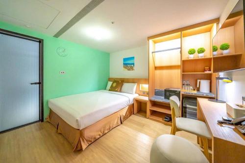 Postel nebo postele na pokoji v ubytování Moonsset INN Taitung