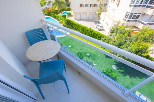 a table and chairs on a balcony with a view at FINALBIR MIMAR- Vistas al mar-Sea view- parking in Albir