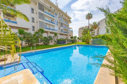a swimming pool in front of a building at FINALBIR MIMAR- Vistas al mar-Sea view- parking in Albir