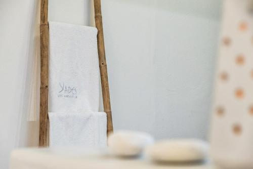 a towel rack with two rolls of toilet paper at Yades - All Sea VIew Suites - Adults only in Naousa