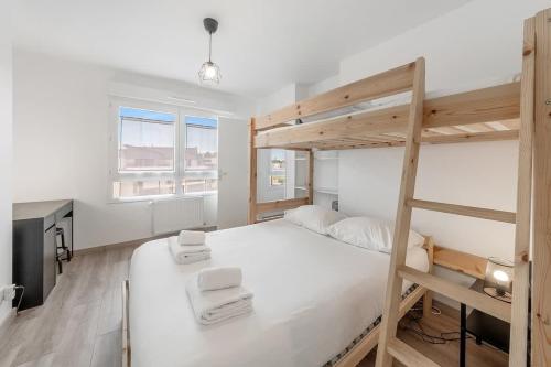 a white bedroom with a bunk bed and a desk at Le Canephora - 800m mer, terrasse, parking, 400m gare in Saint Malo