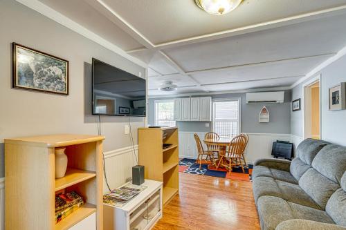 a living room with a couch and a table at Private Dock on Fishing Cove Camdenton Getaway in Camdenton