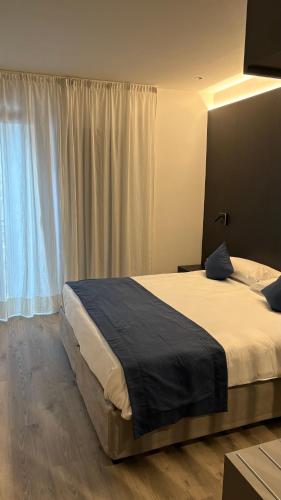 Postel nebo postele na pokoji v ubytování Albergo Cappello e Cadore