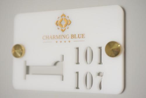 a sign that says changing blue with two clocks at Charming Blue in Vila do Porto