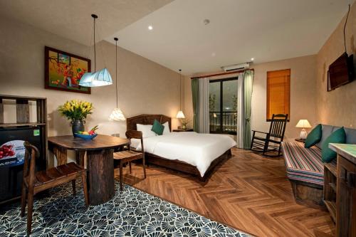 a bedroom with a bed and a living room at Tranquility Suites Westlake in Hanoi