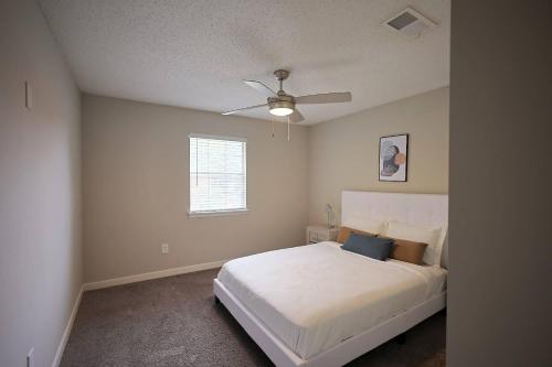 a bedroom with a bed and a ceiling fan at Northtown Apartments 10a I Spacious 1 Bed 1 Bath in Jackson