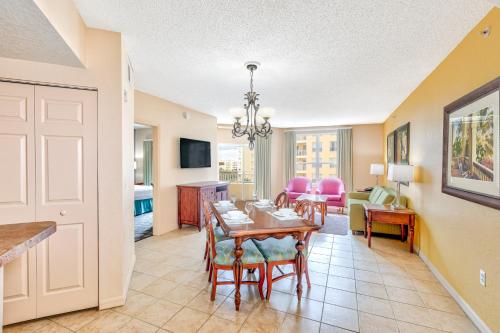 a dining room and living room with a table and chairs at Vacation Village at Parkway in Orlando