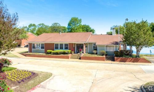a house with a large driveway in front of it at Northtown Apartments 15f I Spacious 1 Bed 1 Bath in Jackson