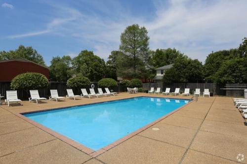 a swimming pool with lounge chairs and a bunch ofitures at Northtown Apartments 15f I Spacious 1 Bed 1 Bath in Jackson