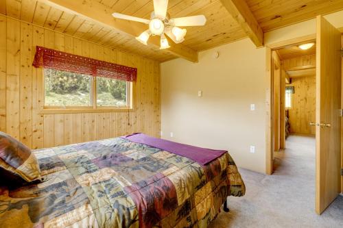 a bedroom with a bed and a ceiling fan at Walk to Sinks Canyon State Park Spacious Home! in Lander