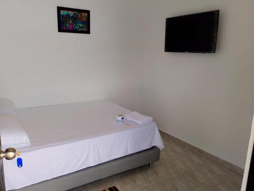 Postel nebo postele na pokoji v ubytování Hostal Johnnier Montería