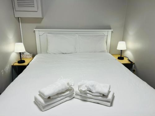 Кровать или кровати в номере Lee's Ocean Peek B & B