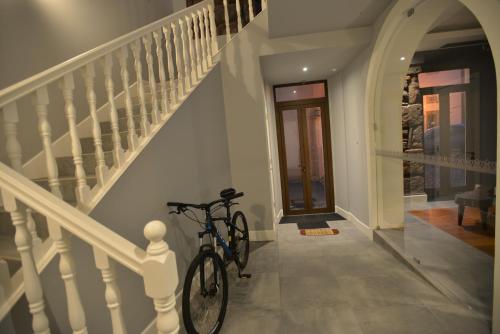 a bike parked in a hallway next to a staircase at Charming Blue in Vila do Porto