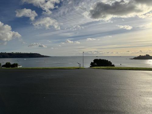 an empty street with a view of the water at Edenhurst By Pureserviced in Plymouth