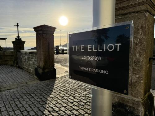 a sign on the side of a building on a street at Edenhurst By Pureserviced in Plymouth