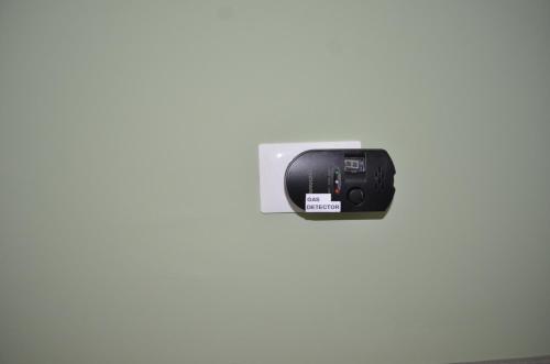 a camera hanging on a wall at Fondachello Suites - tra il vulcano e il Mar Ionio in Mascali