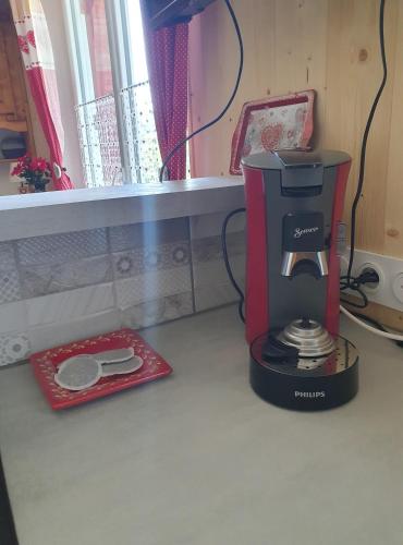 a coffee maker sitting on top of a counter at Résidence La Rose in La Bourboule