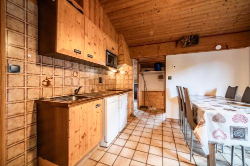 a kitchen with a sink and a counter top at La Flèche d'Or in Châtel