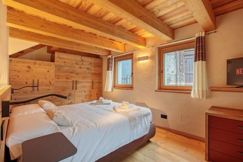 Ένα ή περισσότερα κρεβάτια σε δωμάτιο στο Chalet Eden Blanc