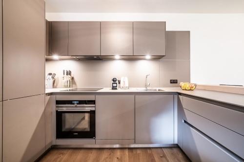 ครัวหรือมุมครัวของ Apartment Osprey Les Gets - by EMERALD STAY