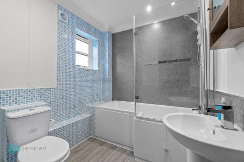 a bathroom with a toilet and a sink and a shower at The Barracks by Pureserviced in Plymouth