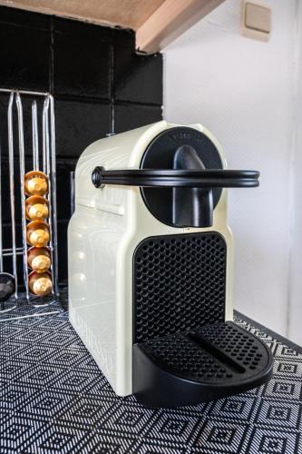 a toaster sitting on top of a kitchen counter at Chez Marraine Suzanne in Liège