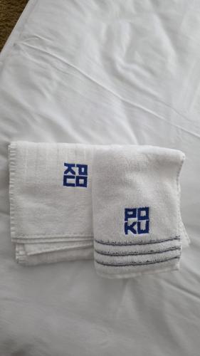 a white towel sitting on top of a bed at Poku bajka in Kranjska Gora