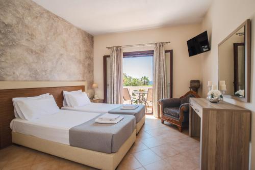 A bed or beds in a room at Angelique Apartments