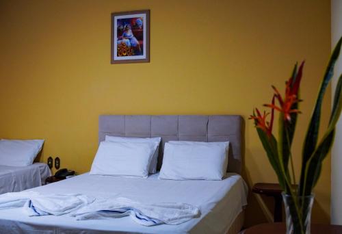 Ένα ή περισσότερα κρεβάτια σε δωμάτιο στο Hotel Pousada San Marco
