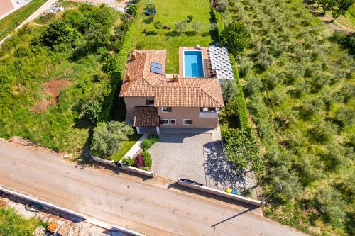 an overhead view of a house with a yard at Villa Roza in Central Istria with whirlpool and playground for kids - pet friendly in Tinjan