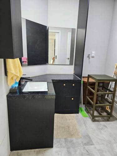 a bathroom with a sink and a mirror at Amsan House in Andong