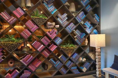 a wall of bookshelves in a library at Arlo Chicago in Chicago
