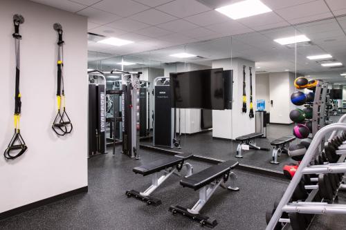 a gym with cardio equipment and a mirror at Arlo Chicago in Chicago