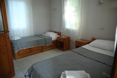 Ένα ή περισσότερα κρεβάτια σε δωμάτιο στο Summer Life Villa Apart