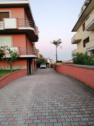 a cobblestone street in front of a building at Casa Rosciano in Rosciano