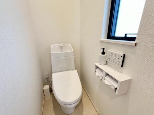 Ένα μπάνιο στο Seaside Condo Nagisa House