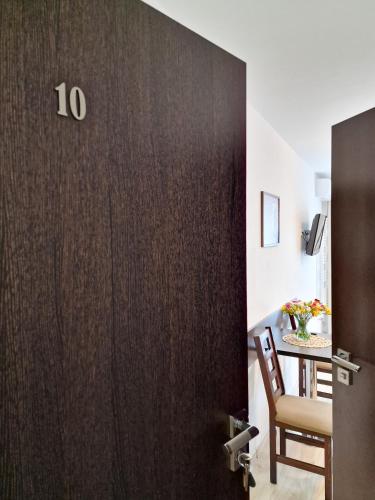 a door with the number on it in a room at Villa Sarema in Chłopy