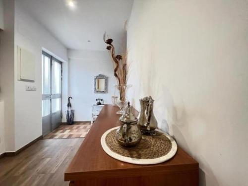 a living room with a table with vases on it at GRUPO GONTAD CASA CARMUCHA in Graña