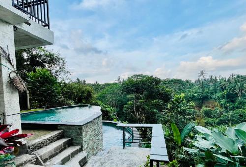 Πισίνα στο ή κοντά στο D'Nanda mini hotel Ubud