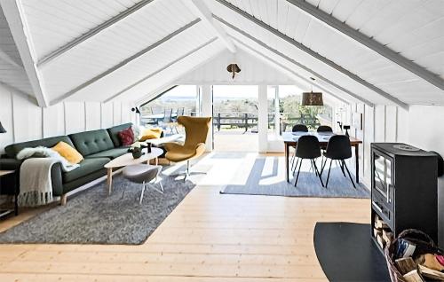 a living room with a couch and a table at Nice Home In Ebeltoft With Wifi in Ebeltoft