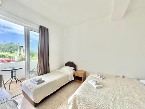 Ένα ή περισσότερα κρεβάτια σε δωμάτιο στο B&M Holiday Rooms