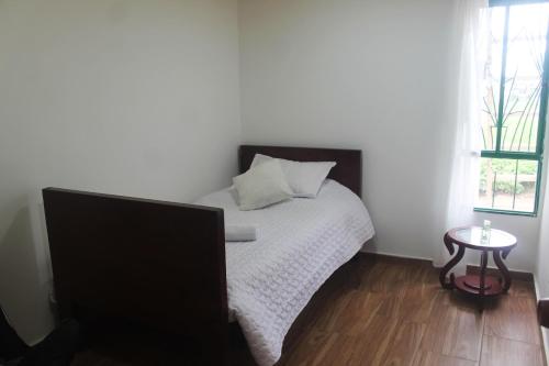 Una cama o camas en una habitación de Casa - Hospedaje Oikos